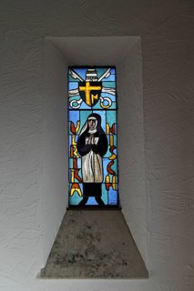 Stained glass window displaying saint Ulrika Nisch