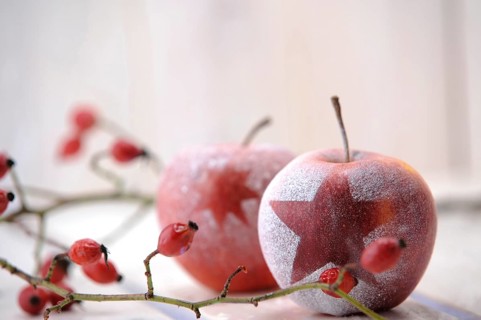 Christmas ambience with red apples and rosehips