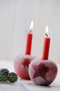 Christmas ambience with red apples and candles