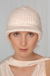 Blond woman with a white woolly hat