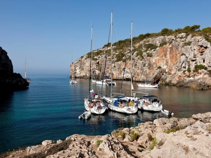 Yachts moored in the bay of Cales Coves