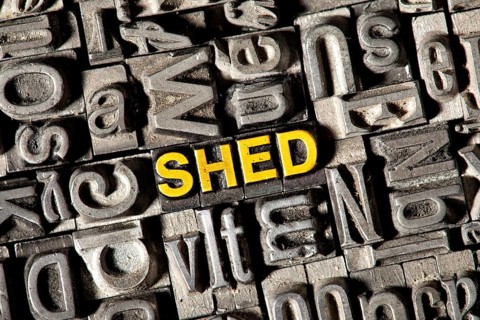 Old lead letters forming the word "SHED"