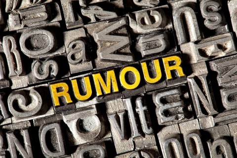 Old lead letters forming the word 'RUMOUR'