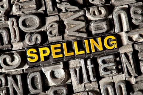 Old lead letters forming the word 'SPELLING'