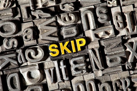 Old lead letters forming the word "SKIP"