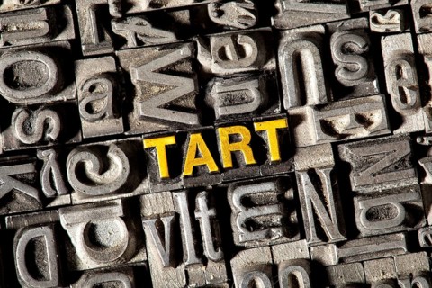 Old lead letters forming the word 'TART'