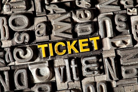 Old lead letters forming the word 'TICKET'
