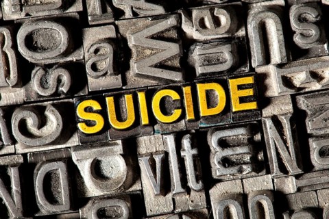 Old lead letters forming the word "SUICIDE"