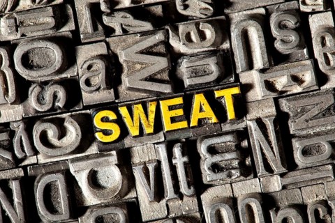 Old lead letters forming the word 'SWEAT'