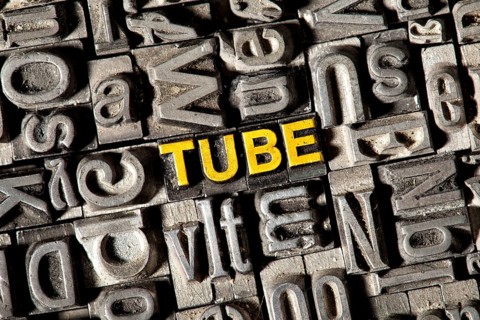 Old lead letters forming the word Tube