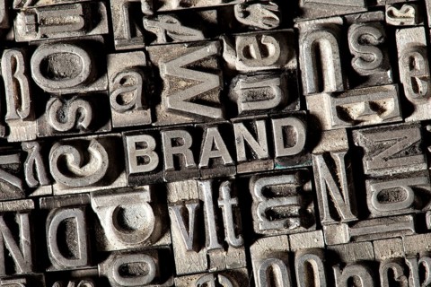 Old lead letters forming the word 'BRAND'