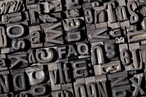 Old lead letters forming the acronym FAQ