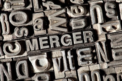 Old lead letters forming the word 'MERGER'