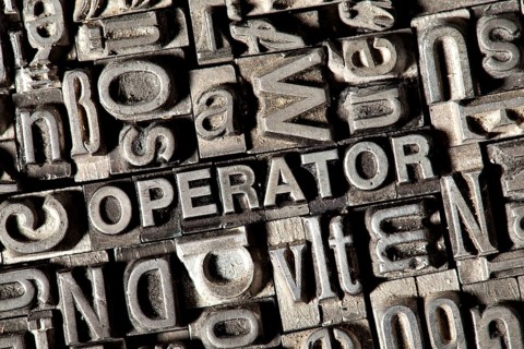 Old lead letters forming the word OPERATOR