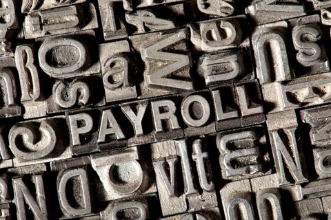 Old lead letters forming the word 'PAYROLL'