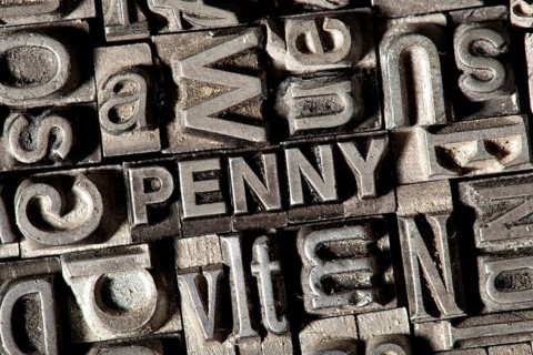Old lead letters forming the word 'PENNY'