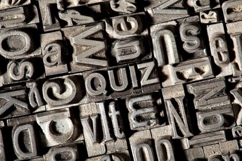 Old lead letters forming the word 'QUIZ'