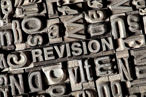 Old lead letters forming the word REVISION