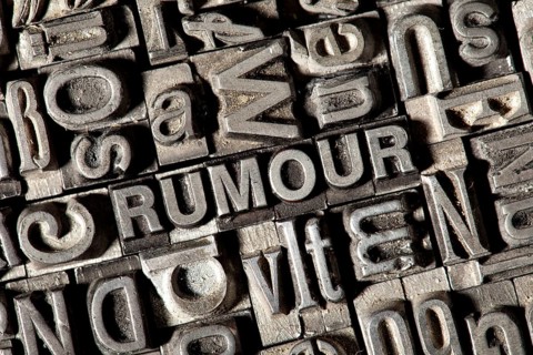 Old lead letters forming the word RUMOUR