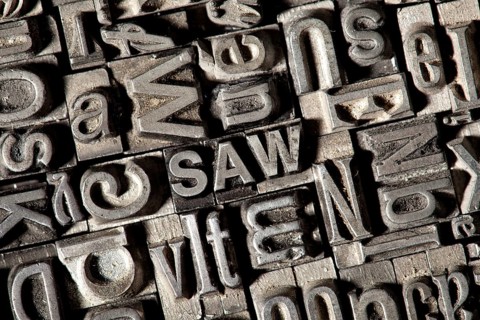 Old lead letters forming the word SAW