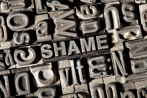 Old lead letters forming the word SHAME
