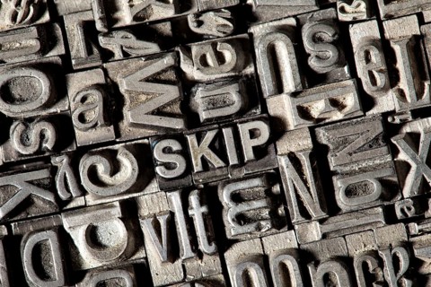 Old lead letters forming the word SKIP