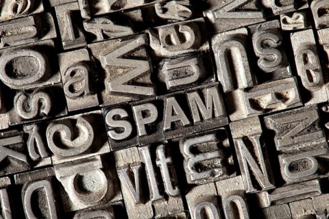 Old lead letters forming the word 'SPAM'