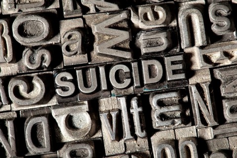 Old lead letters forming the word "SUICIDE"