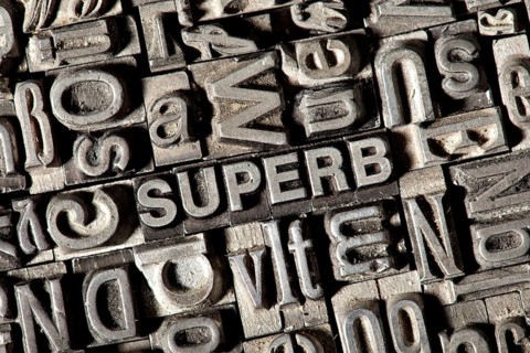 Old lead letters forming the word 'SUPERB'