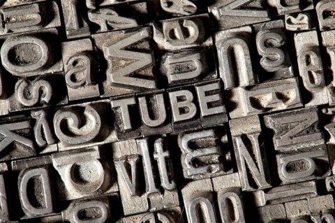 Old lead letters forming the word TUBE