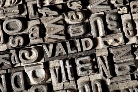 Old lead letters forming the word VALID