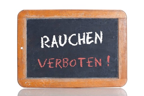 Old school blackboard with the words RAUCHEN VERBOTEN!