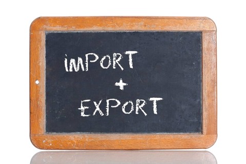Old school blackboard with the words IMPORT + EXPORT