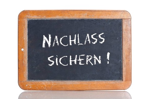 Old school blackboard with the words NACHLASS SICHERN!