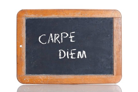 Old school blackboard with the phrase CARPE DIEM
