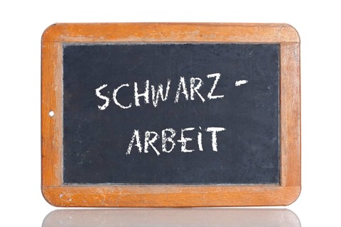 Old school blackboard with the term SCHWARZARBEIT