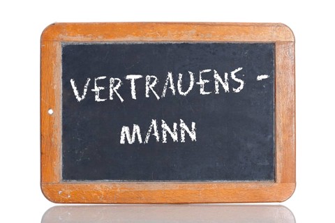 Old school blackboard with the term VERTRAUENSMANN
