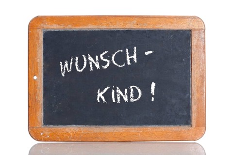 Old school blackboard with the term WUNSCHKIND