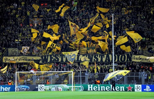 BVB fans in the south stand waving their flags before the start of the game