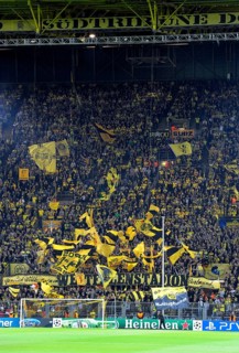 BVB fans in the south stand waving their flags before the start of the game