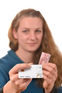 Woman holding a health insurance card and a 10 euro banknote