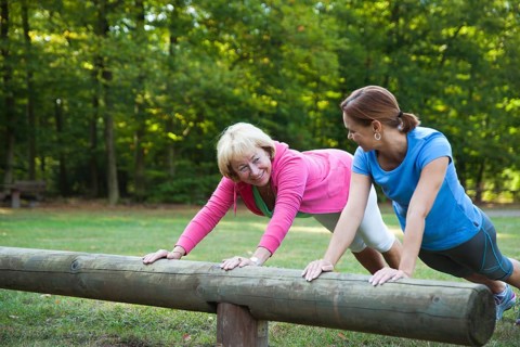 Women exercising on an outdoor fitness trail