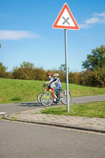 Children on bicycles at a traffic awareness course