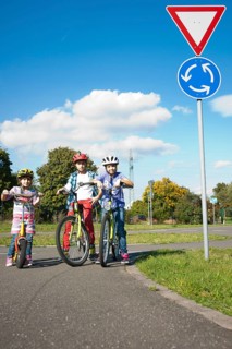 Children on bicycles at a traffic awareness course