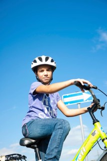 Girl wearing a bike helmet at a traffic awareness course