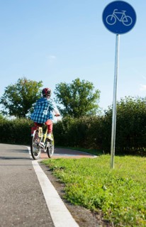 Child riding a bicycle at a traffic awareness course