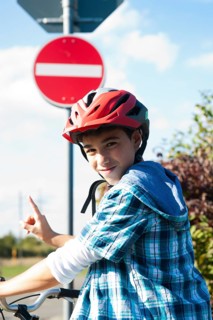 Boy wearing a bike helmet at a traffic awareness course