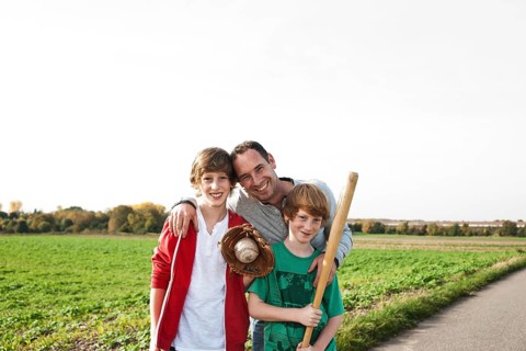 Father playing baseball with his sons