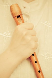 Hand holding a flute