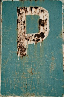 Rusty parking sign